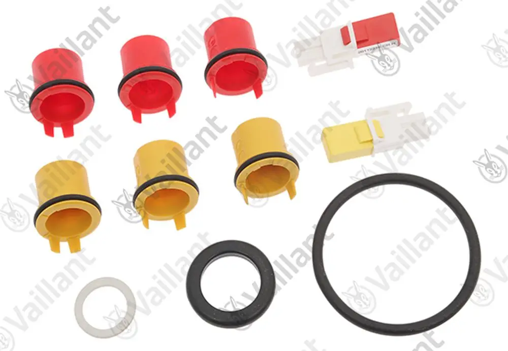 Vaillant Umstellsatz bestehend aus verschiedenen farbigen Kunststoffelementen und Gummidichtungen zur Anpassung an Heizsysteme.